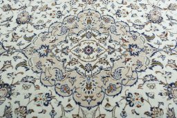 Backside of handmade 2000s Kashan rug showing knot structure and weave density