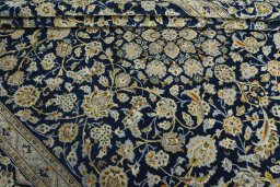 Close-up detail of 1970s Kashan rug from Iran / Persia showing Wool weave
