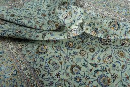 Surface texture of 2000s Kashan rug with natural Wool and intricate pattern