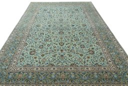 Surface texture of 2000s Kashan rug with natural Wool and intricate pattern