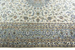 Corner detail of 2000s Kashan rug showing border pattern and Wool pile
