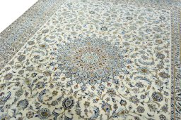 Backside of handmade 2000s Kashan rug showing knot structure and weave density