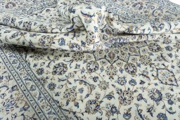 Surface texture of 2000s Kashan rug with natural Wool and intricate pattern