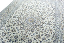 Backside of handmade 2000s Kashan rug showing knot structure and weave density