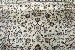 Close-up detail of 2000s Kashan rug from Iran / Persia showing Wool weave