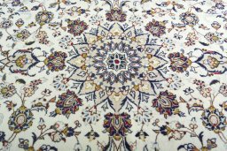 Central medallion detail of 2000s Kashan rug from Iran / Persia