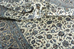 Surface texture of 2000s Kashan rug with natural Wool and intricate pattern