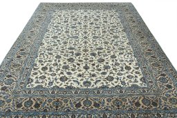 Surface texture of 2000s Kashan rug with natural Wool and intricate pattern