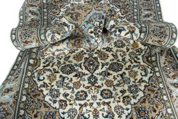 Surface texture of 2000s Kashan rug with natural Wool and intricate pattern