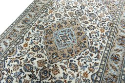 Backside of handmade 2000s Kashan rug showing knot structure and weave density