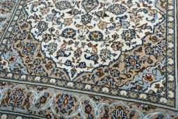 Close-up detail of 2000s Kashan rug from Iran / Persia showing Wool weave