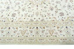 Corner detail of New Kashan rug showing border pattern and Wool pile