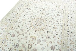 Backside of handmade New Kashan rug showing knot structure and weave density