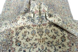 Surface texture of 2000s Kashan rug with natural Wool and intricate pattern
