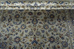 Close-up detail of 2000s Kashan rug from Iran / Persia showing Wool weave