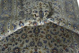 Surface texture of 2000s Kashan rug with natural Wool and intricate pattern