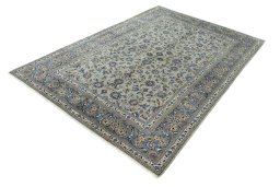 Corner detail of 2000s Kashan rug showing border pattern and Wool pile