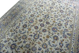 Backside of handmade 2000s Kashan rug showing knot structure and weave density