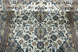 Close-up detail of 2000s Kashan rug from Iran / Persia showing Wool weave