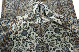 Surface texture of 2000s Kashan rug with natural Wool and intricate pattern