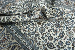 Surface texture of 2000s Kashan rug with natural Wool and intricate pattern