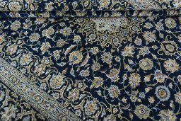 Close-up detail of 2000s Kashan rug from Iran / Persia showing Wool weave