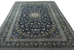 Surface texture of 2000s Kashan rug with natural Wool and intricate pattern