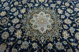 Central medallion detail of 2000s Kashan rug from Iran / Persia
