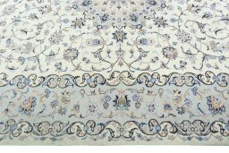Corner detail of New Kashan rug showing border pattern and Wool pile