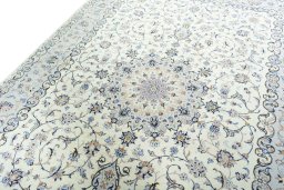 Backside of handmade New Kashan rug showing knot structure and weave density