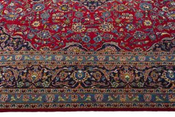 Corner detail of 2000s Kashan rug showing border pattern and Wool pile