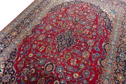 Backside of handmade 2000s Kashan rug showing knot structure and weave density