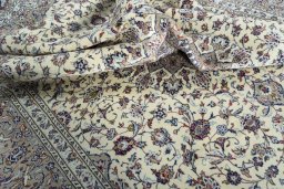 Surface texture of 2000s Kashan rug with natural Wool and intricate pattern