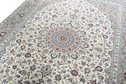Backside of handmade 2000s Kashan rug showing knot structure and weave density