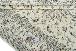 Close-up detail of 2000s Kashan rug from Iran / Persia showing Wool weave