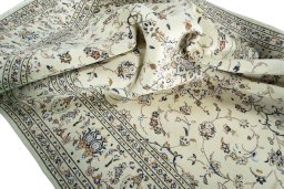 Surface texture of 2000s Kashan rug with natural Wool and intricate pattern