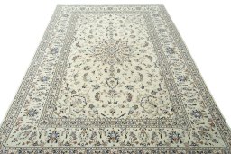 Surface texture of 2000s Kashan rug with natural Wool and intricate pattern
