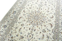 Backside of handmade 2000s Kashan rug showing knot structure and weave density