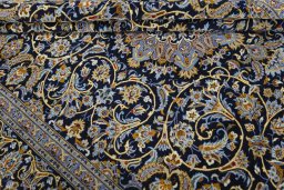 Close-up detail of 2000s Kashan rug from Iran / Persia showing Wool weave