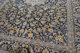 Close-up detail of 2000s Kashan rug from Iran / Persia showing Wool weave