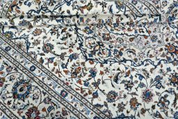 Close-up detail of 2000s Kashan rug from Iran / Persia showing Wool weave