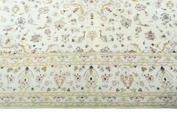 Corner detail of New Kashan rug showing border pattern and Wool pile