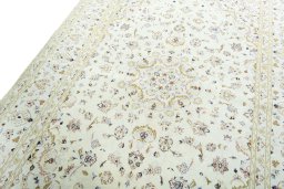Backside of handmade New Kashan rug showing knot structure and weave density