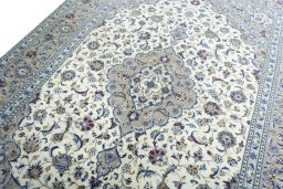 Backside of handmade 2000s Kashan rug showing knot structure and weave density
