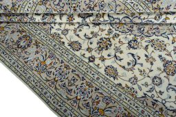 Close-up detail of 2000s Kashan rug from Iran / Persia showing Wool weave