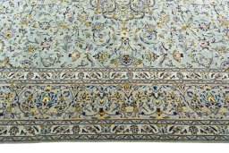 Corner detail of 2000s Kashan rug showing border pattern and Wool pile