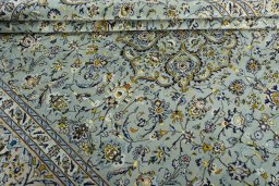 Close-up detail of 2000s Kashan rug from Iran / Persia showing Wool weave