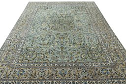 Surface texture of 2000s Kashan rug with natural Wool and intricate pattern