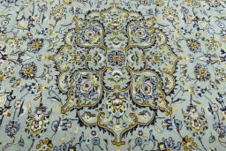 Central medallion detail of 2000s Kashan rug from Iran / Persia