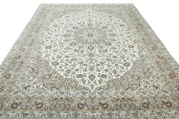 Surface texture of 2000s Kashan rug with natural Wool and intricate pattern